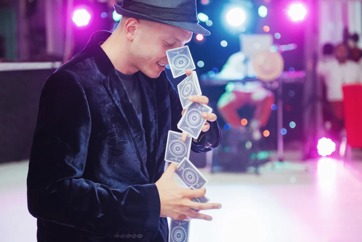 Magician performing card trick at wedding - Live Music Entertainment Edmonton - Talent Productions